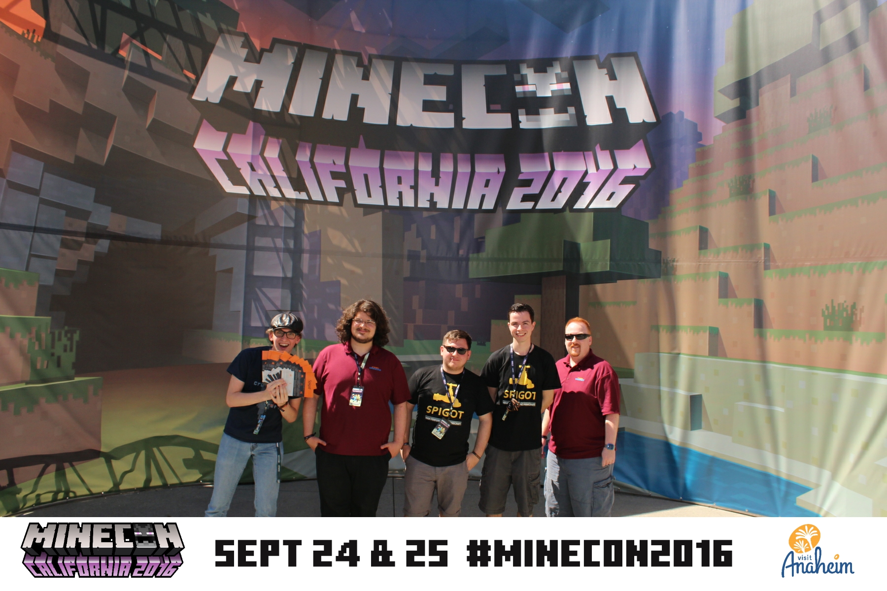 Some of the team poses in front of the big MINECON 2016 banner in Anaheim, California