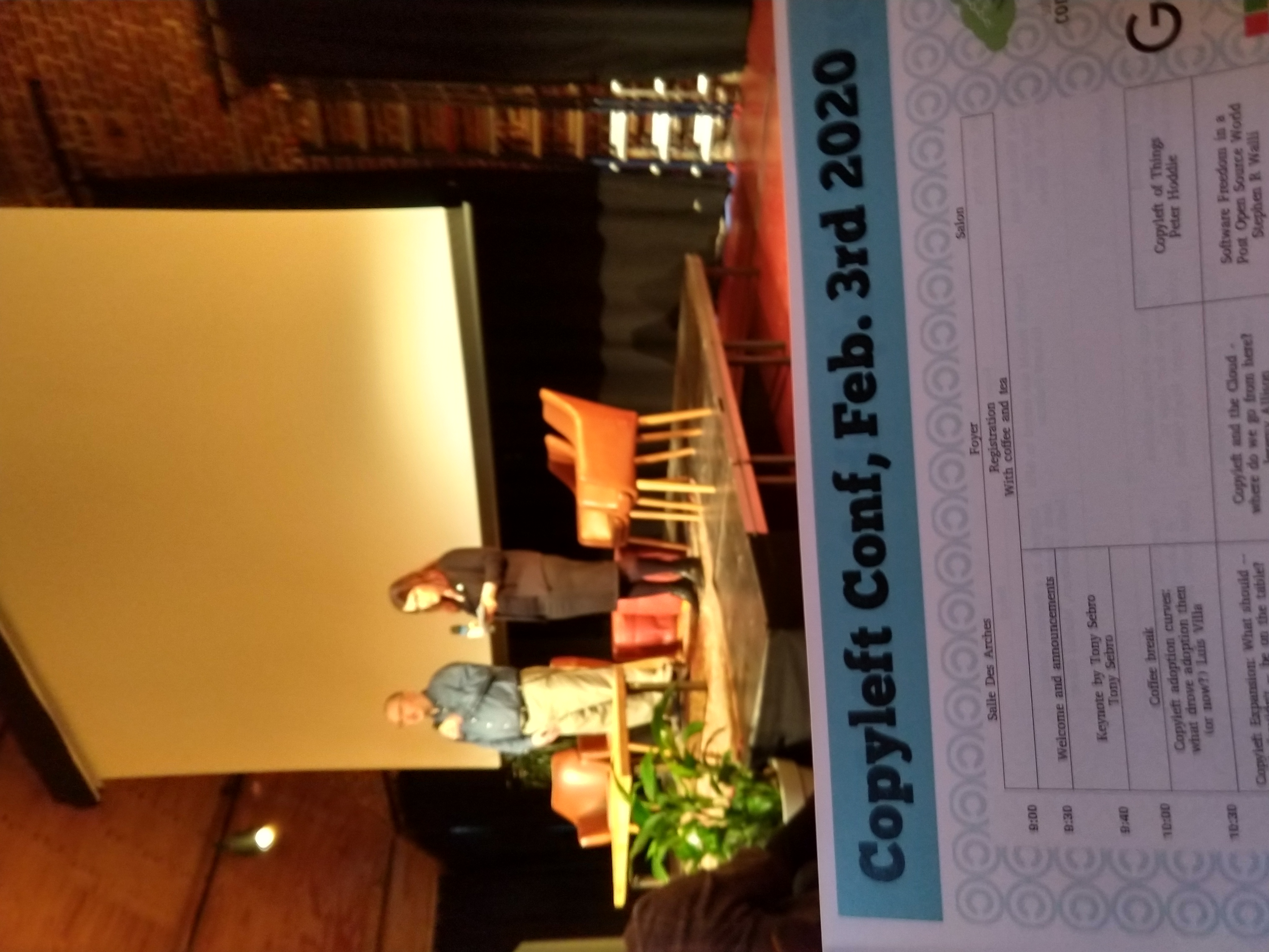 Me excitingly looking up to the main stage, holding my CopyleftConf 2020 schedule, after having bought my ticket earlier that same morning.