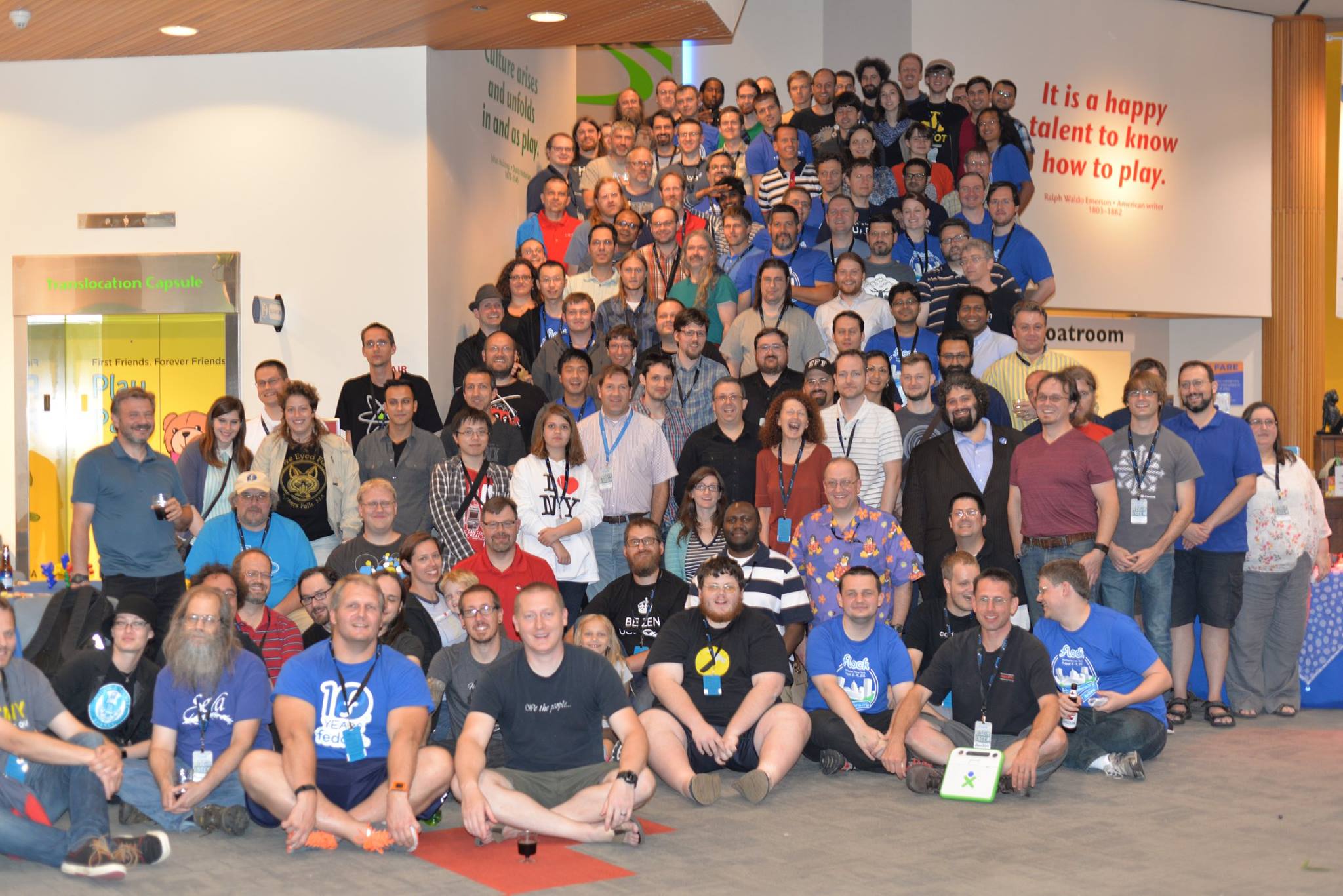 Group photo of Fedora Flock 2015 attendees at the Strong Museum of Play
